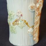 Old pitcher in slip 1900 ivy or holly decoration