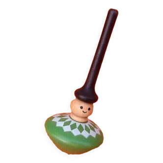 Spinning top Turned and painted wood Character decoration with a high conical hat.