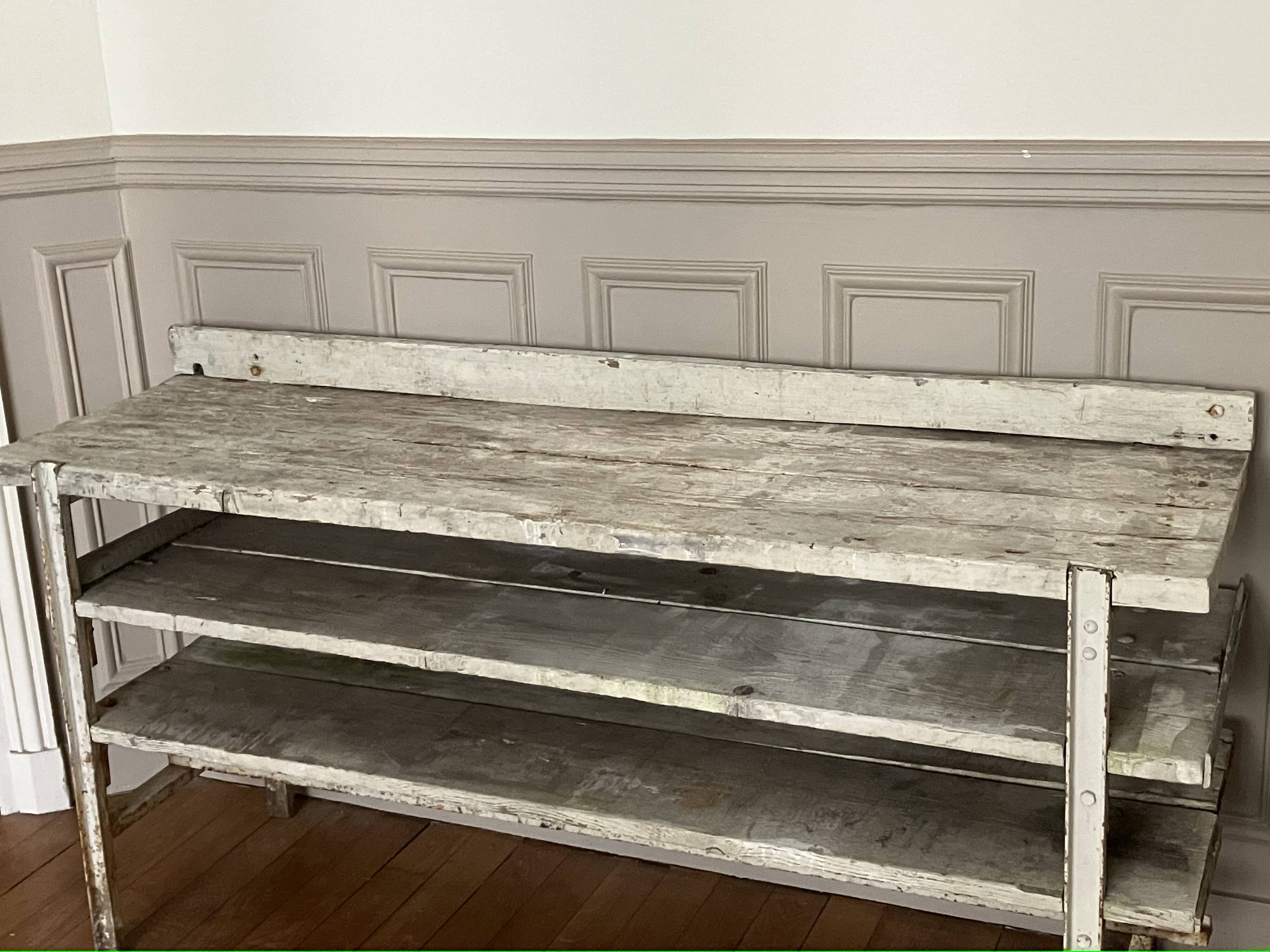 Old workbench, a piece of wooden and metal furniture.