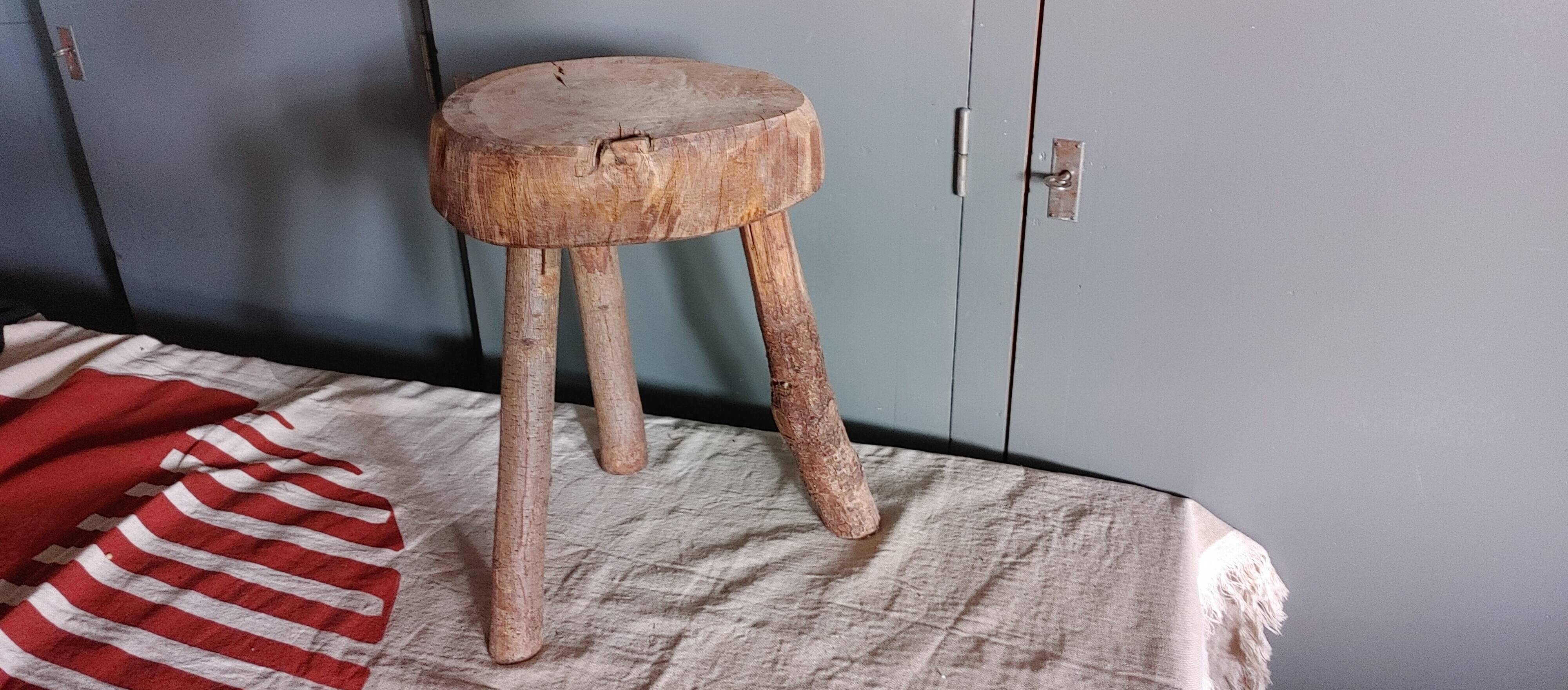 Old small country stool in raw wood - tripod base