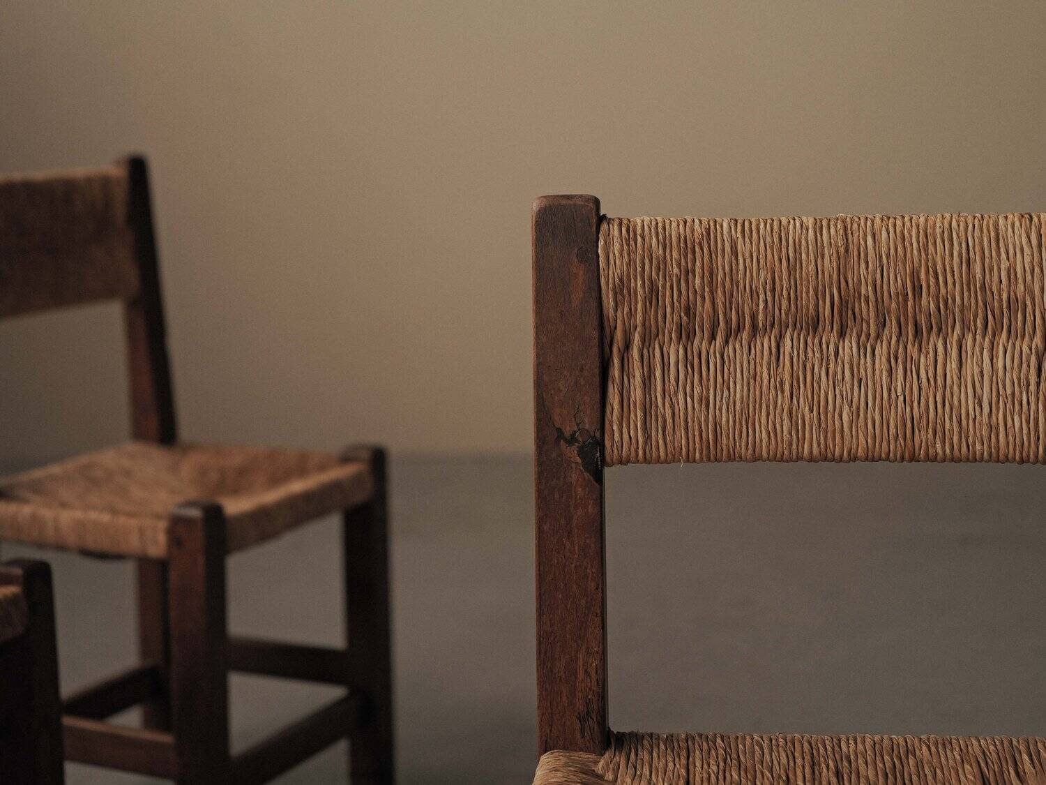 Set of four modernist chairs in oak and straw, France, circa 1960.