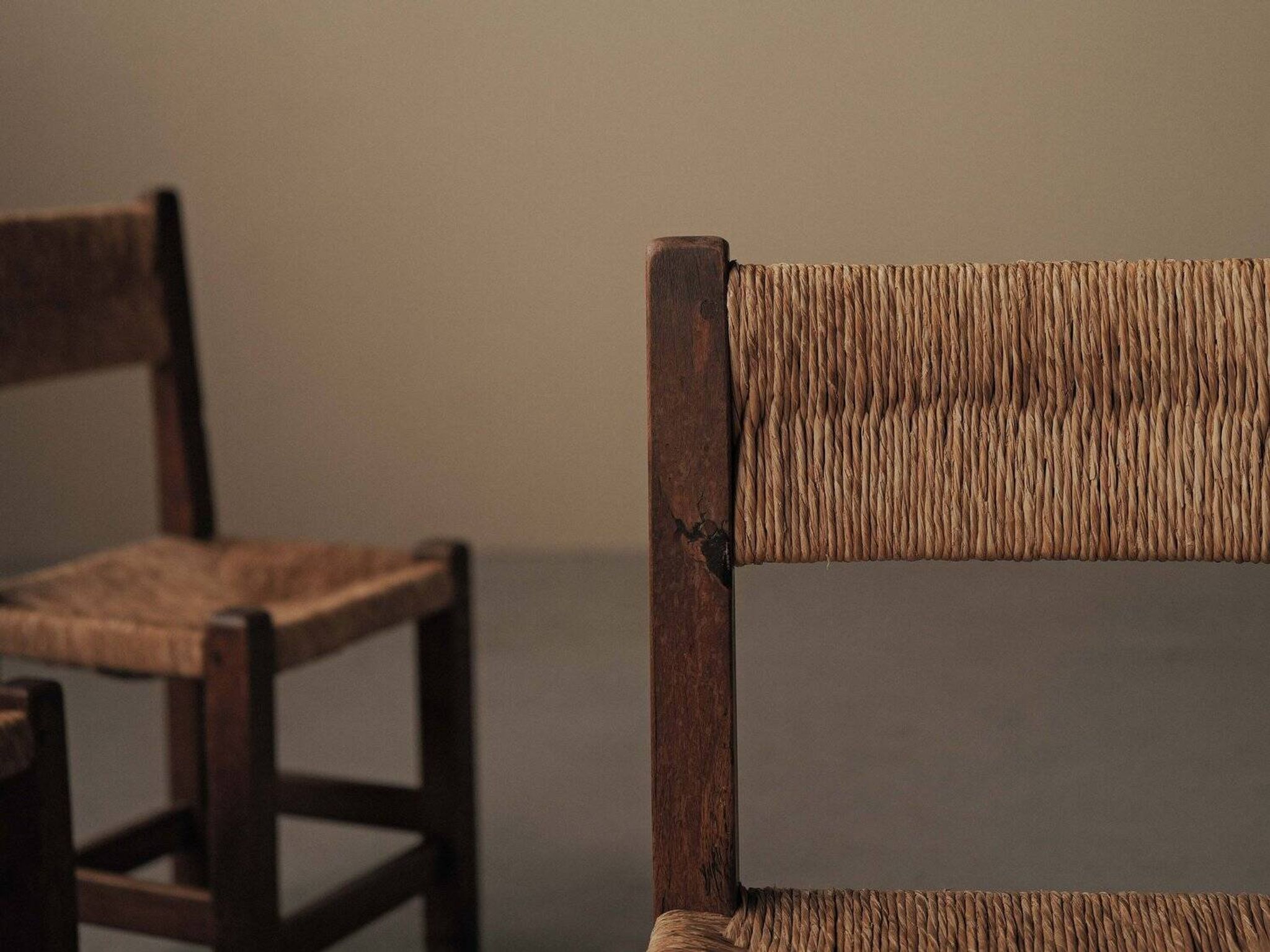 Set of four modernist chairs in oak and straw, France, circa 1960.