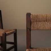 Set of four modernist chairs in oak and straw, France, circa 1960.