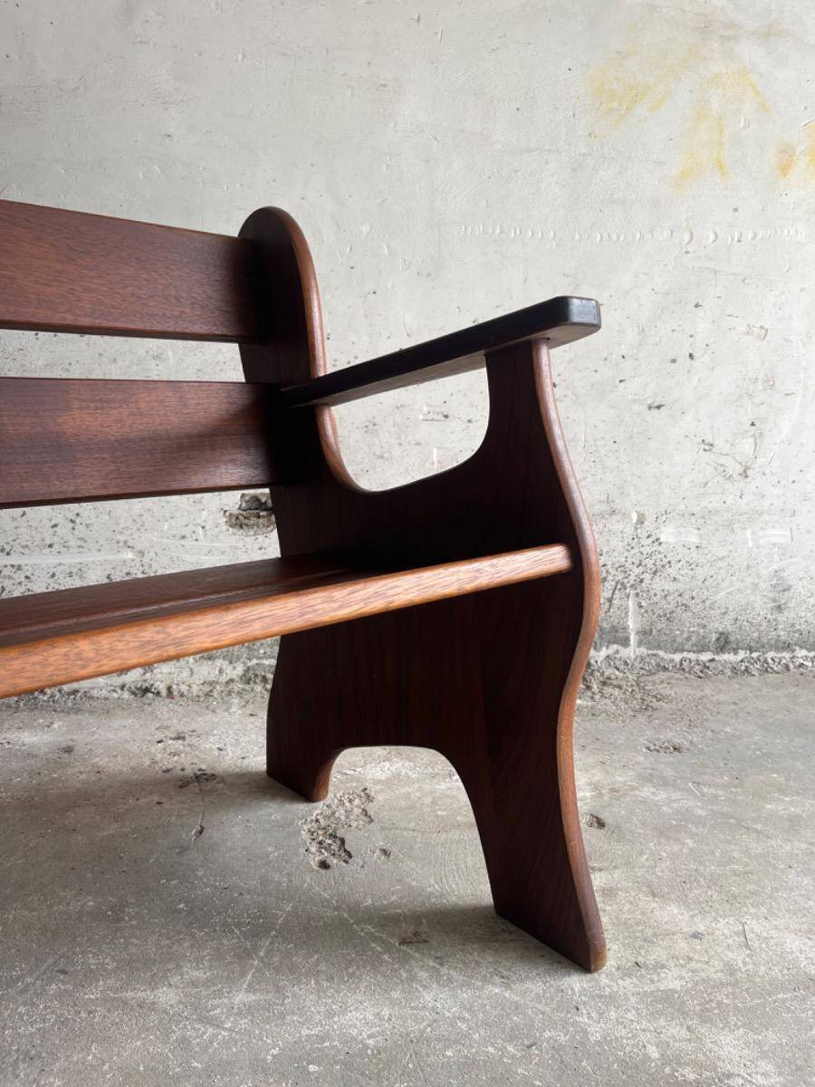 Set of two dark brown solid wood brutalist sculptural chairs with carved details
