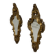 Pair of mirrors in wood decorated with gold leaf.