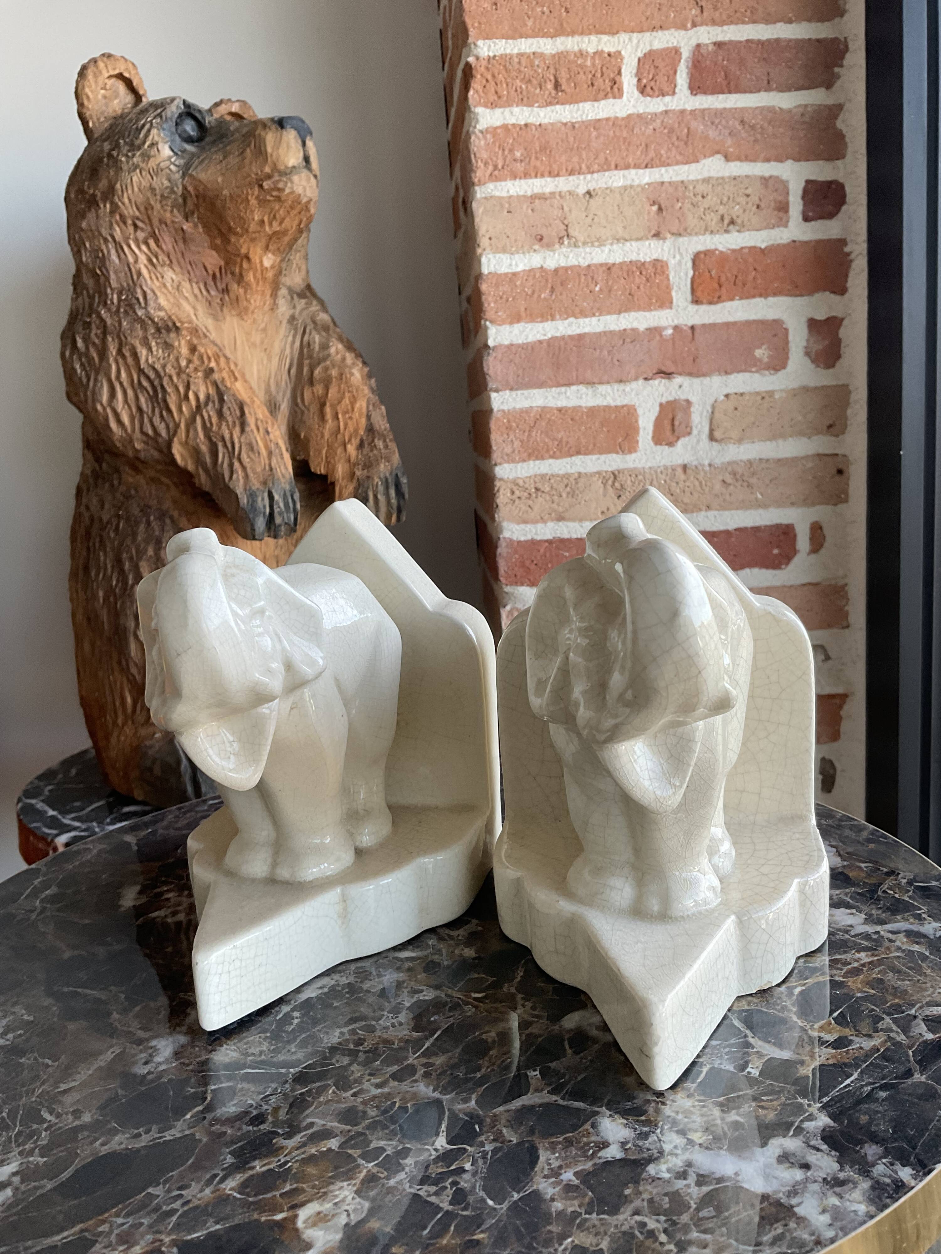 Pair of cracked earthenware bookends. ART DECO
