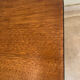 Mid-century coffee table with tapered legs.