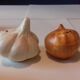 Pepper salt shaker in the shape of garlic and onion head