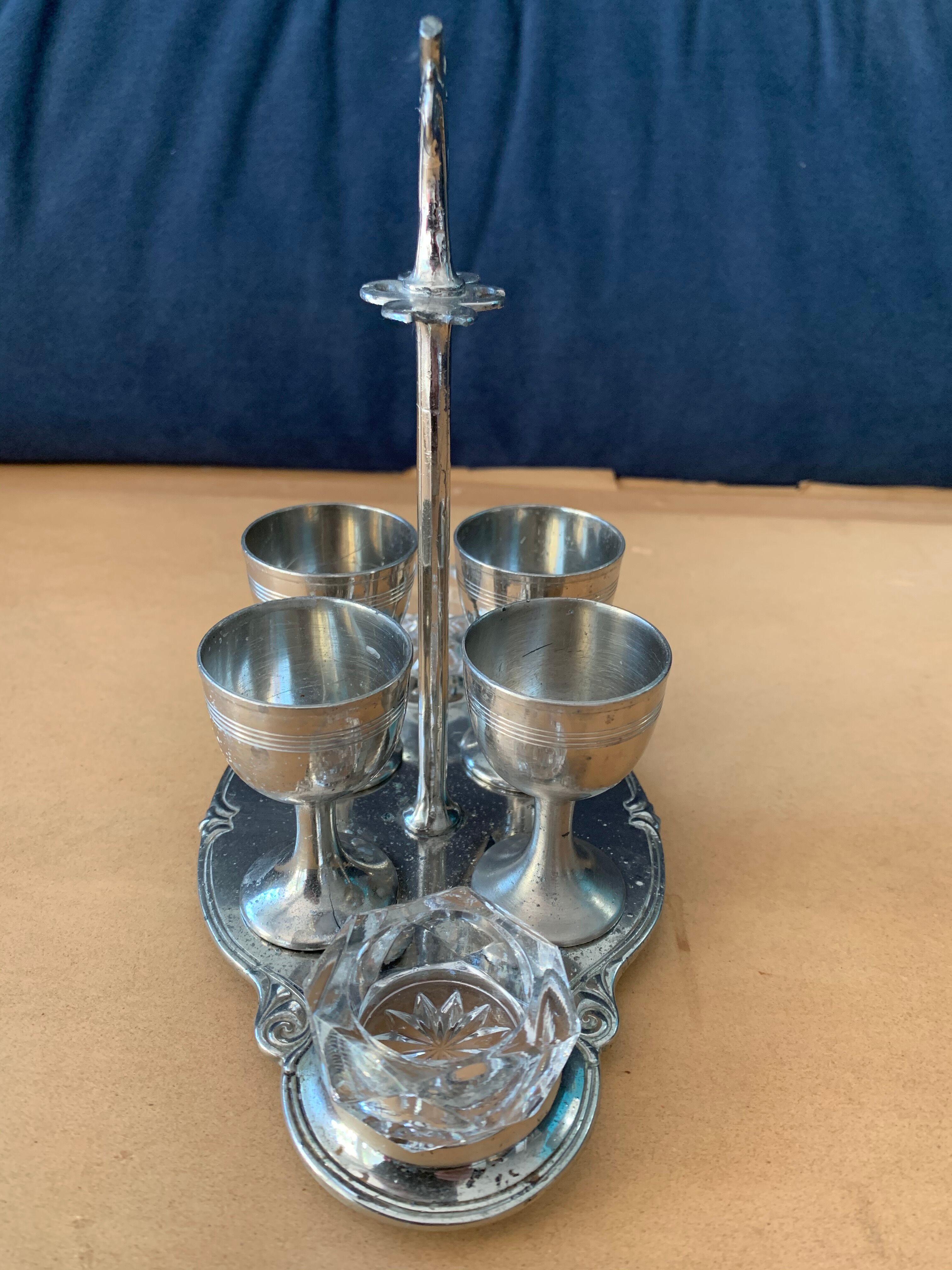 Old serving for boiled eggs with 4 metal cockroaches