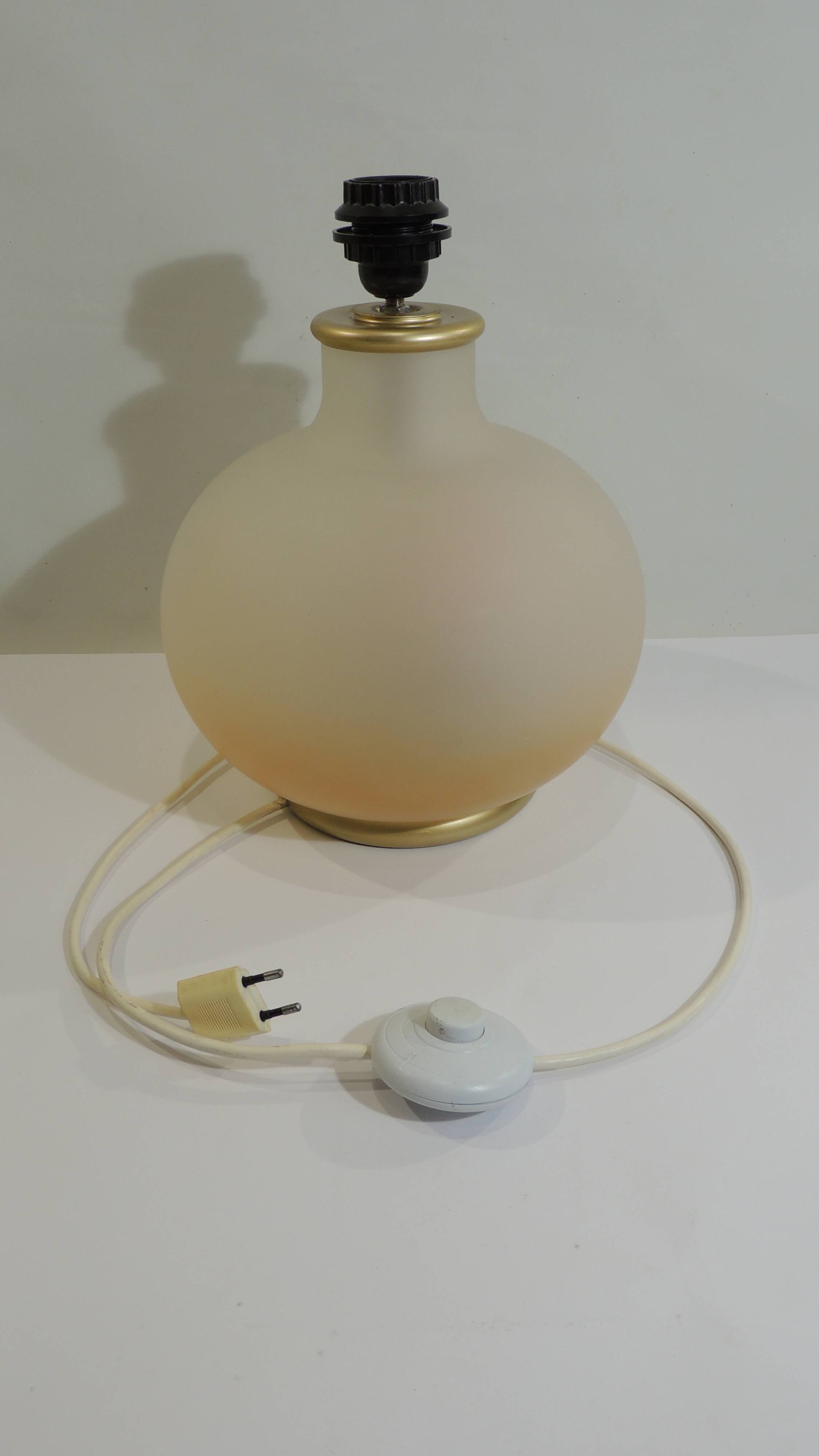 Vintage frosted glass lamp, round globe, elegant design, soft light.