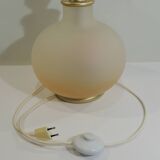 Vintage frosted glass lamp, round globe, elegant design, soft light.