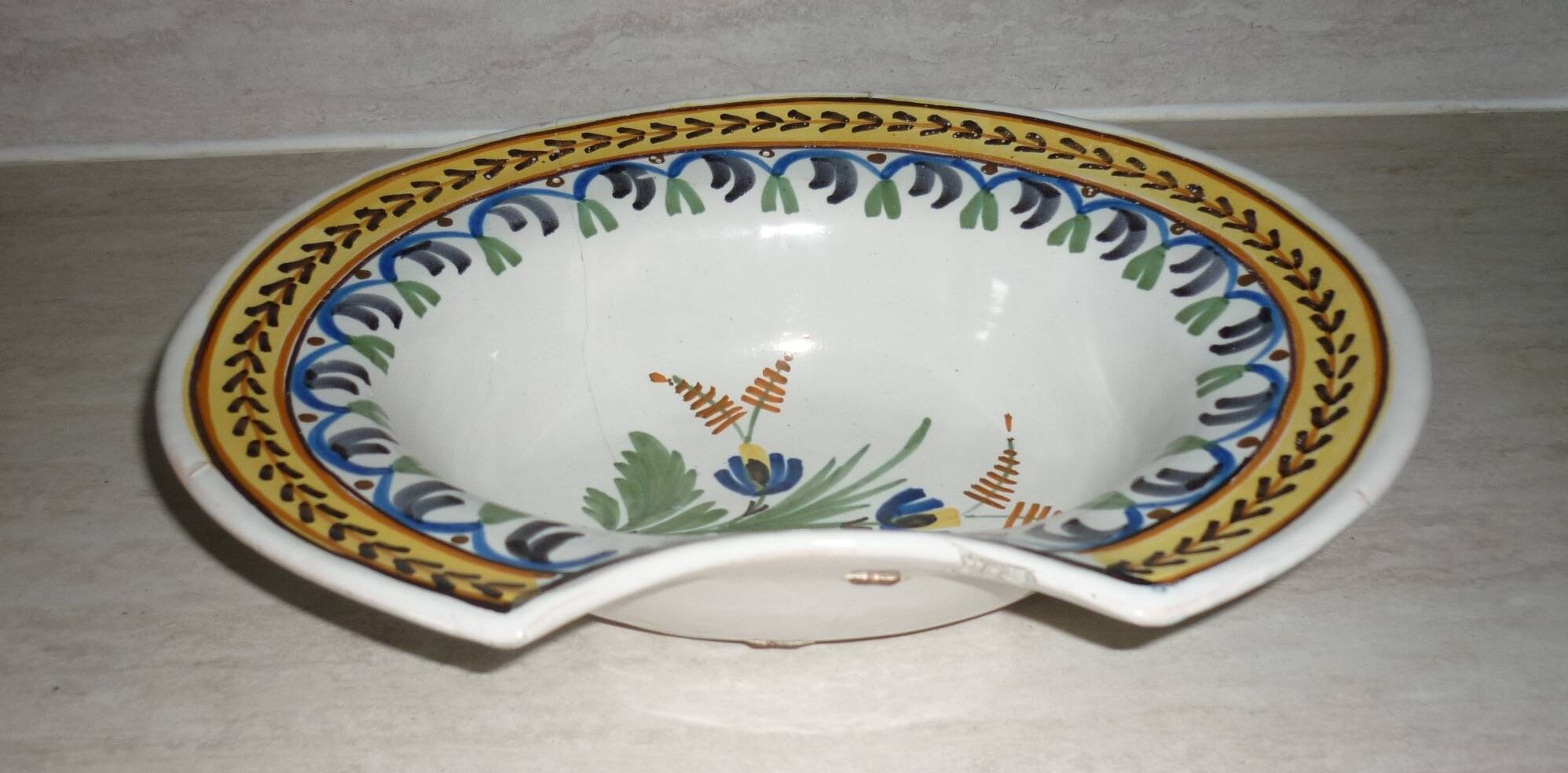 Old beard dish repair with staples