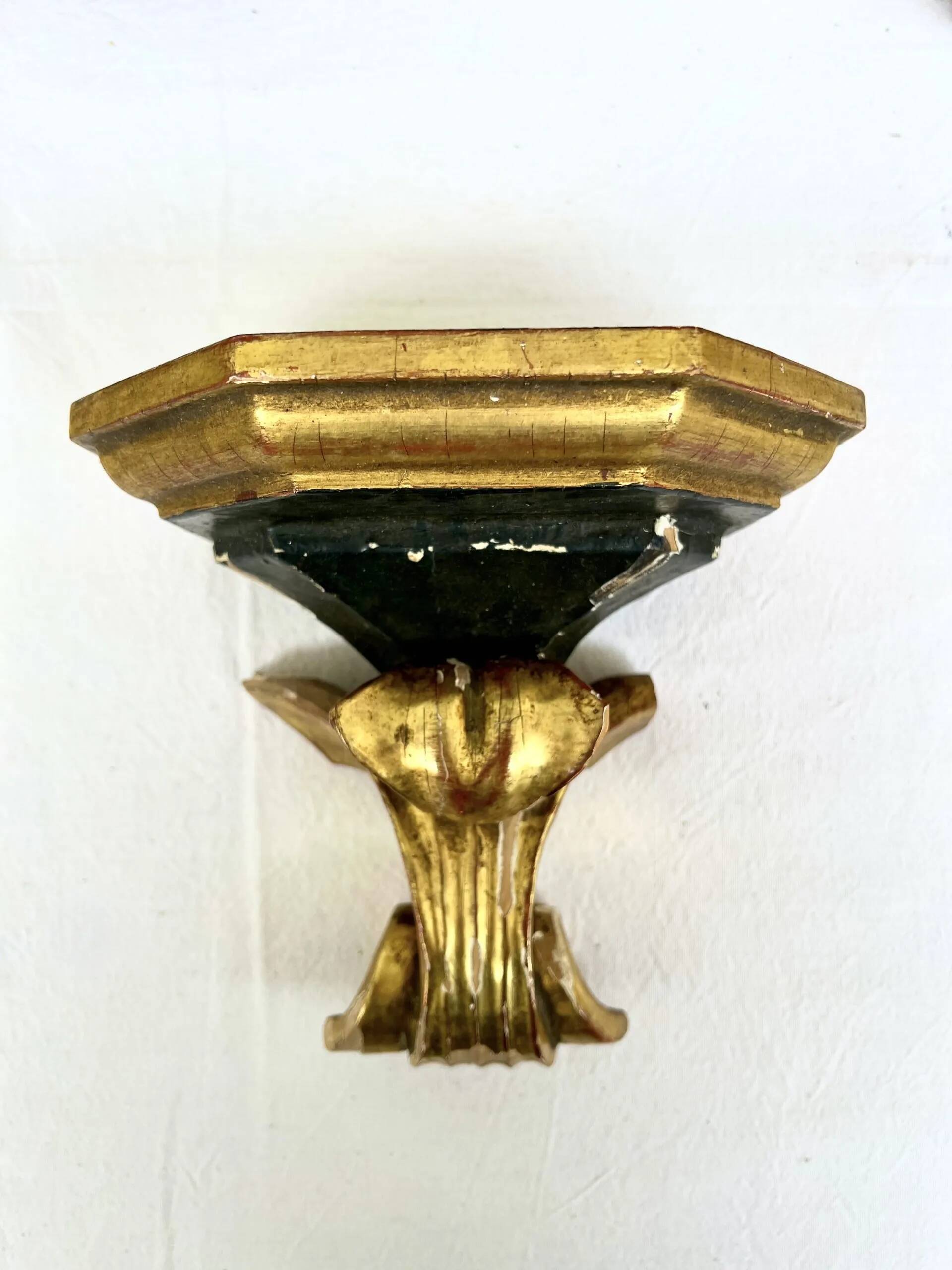 Wall-mounted console in painted gold wood