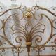 Golden wrought iron bedhead