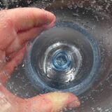 Candlestick or photophore in sky blue bulled glass, signed Biot