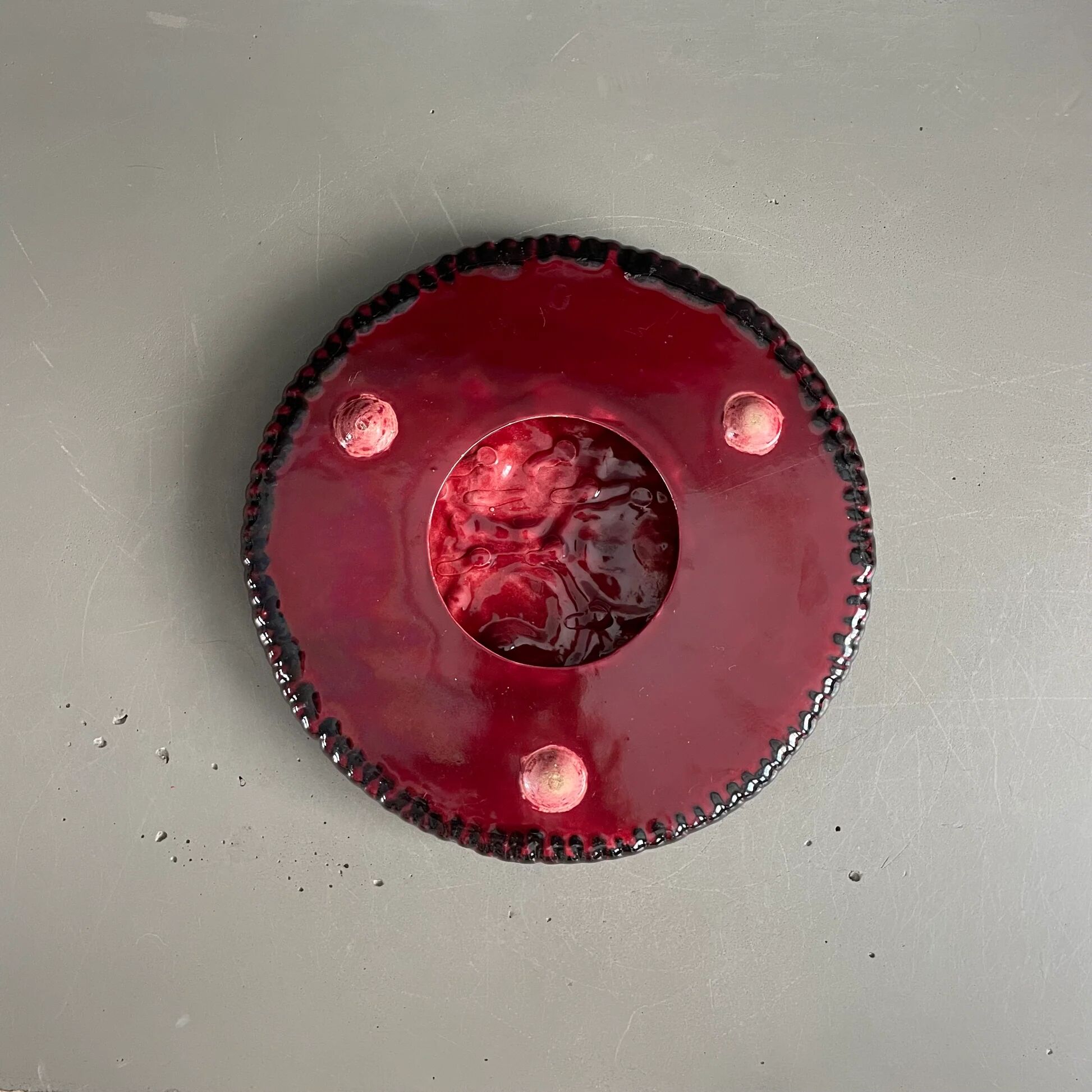 Burgundy ceramic trivet