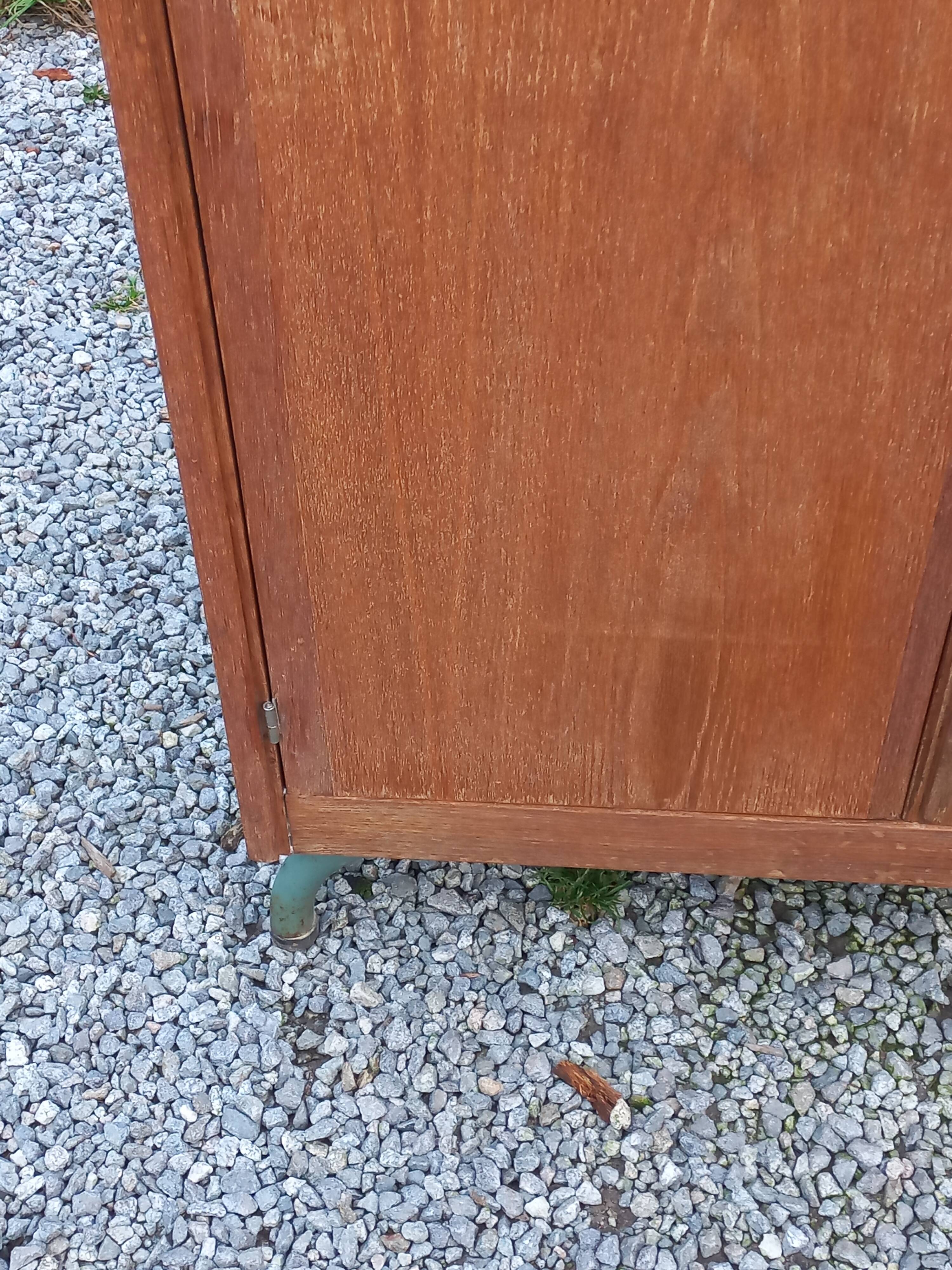 Vintage oak wardrobe with metal legs from the 1950s.