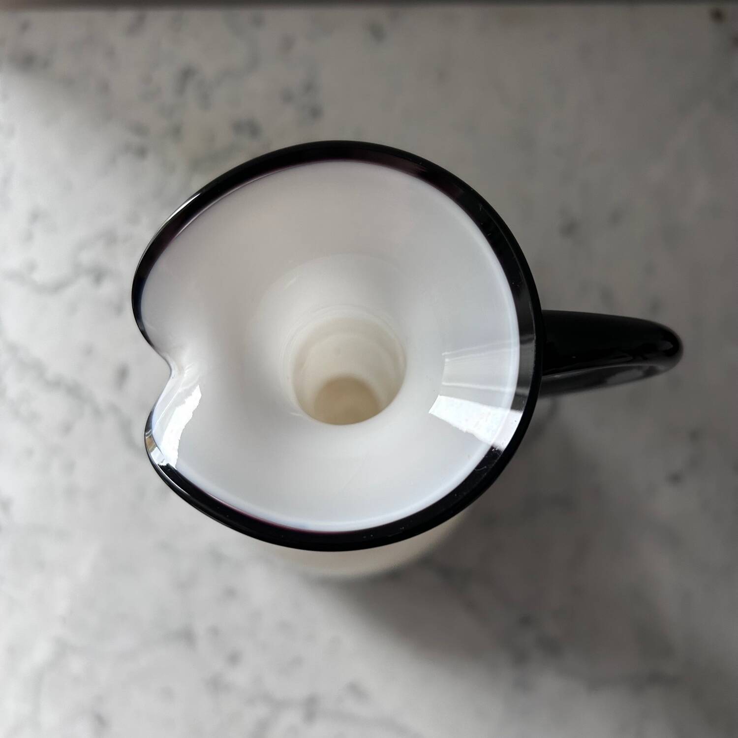 Single flower vase in white and black opaline