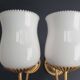Pair of vintage gold-tone wall sconces with opaline glass globes