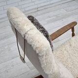 1970s, Danish rocking chair, reupholstered in quality genuine sheepskin.
