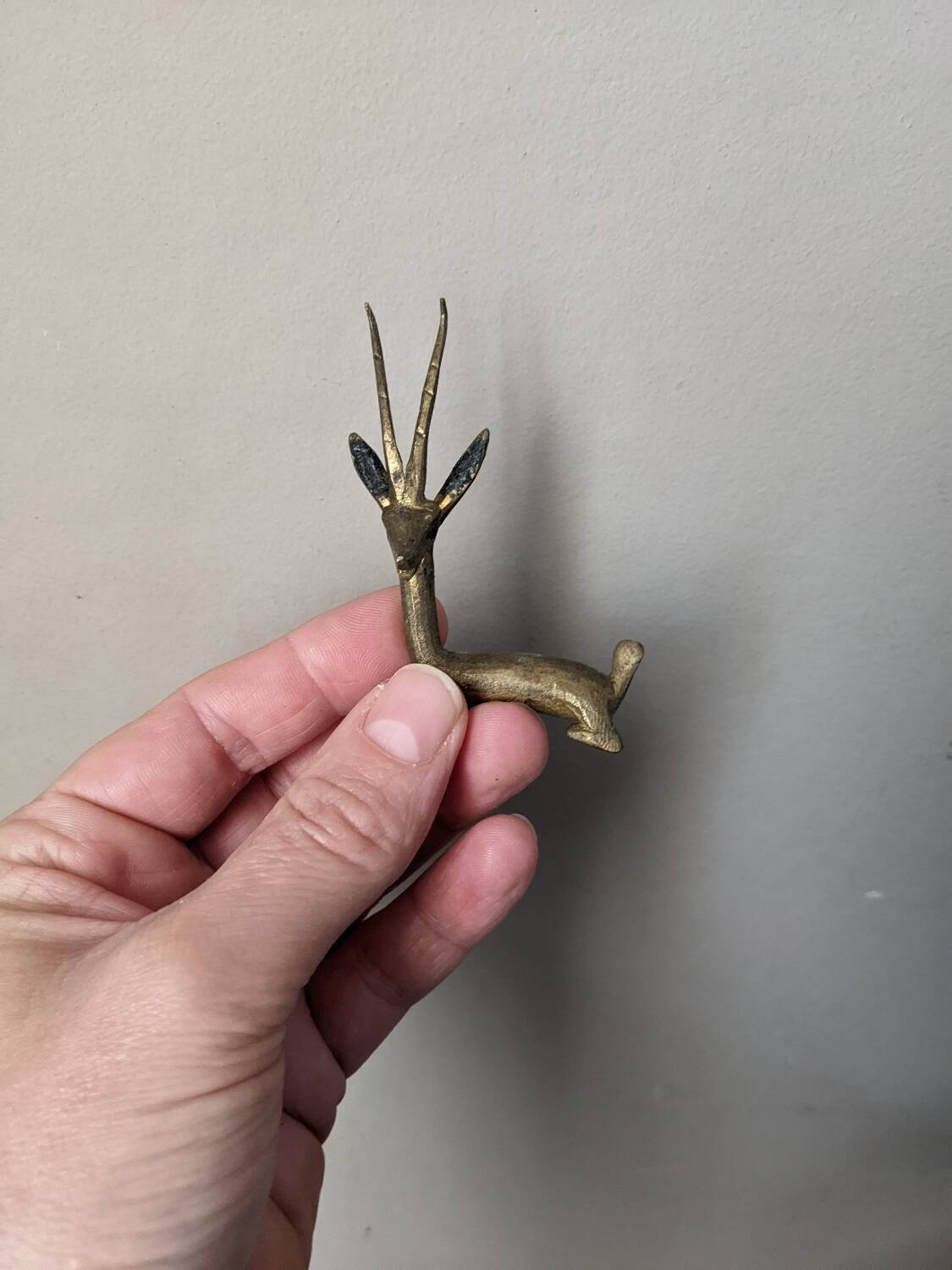12 bronze and brass knife rests, African art, gazelles