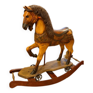 Ancient wooden rocking horse with original paint, hand-carved.