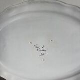 Large earthenware dish from Moustiers, signed Féret