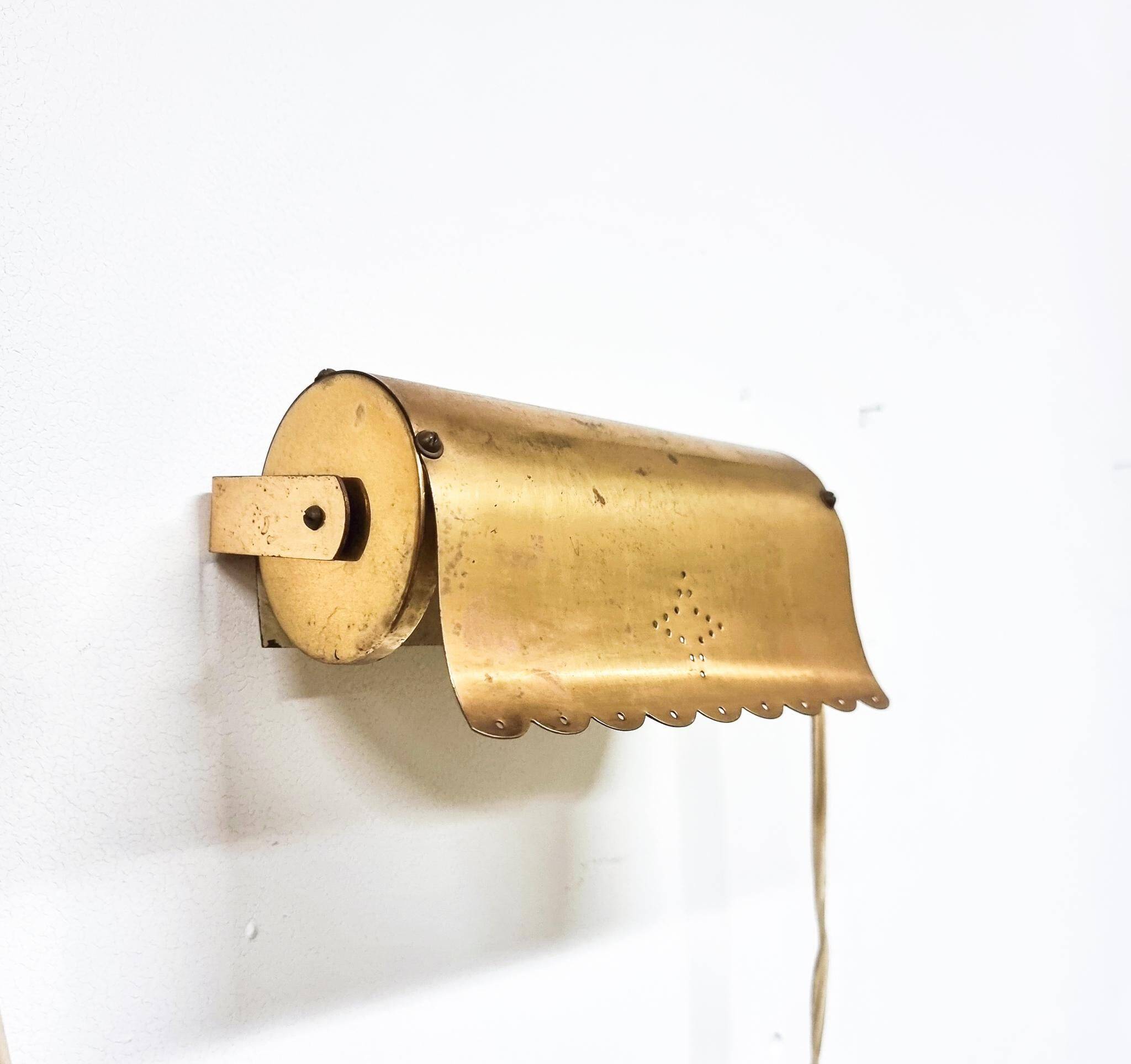 A pair of charming wall sconces/branches in brass with a star pattern, modern Scandinavian style.