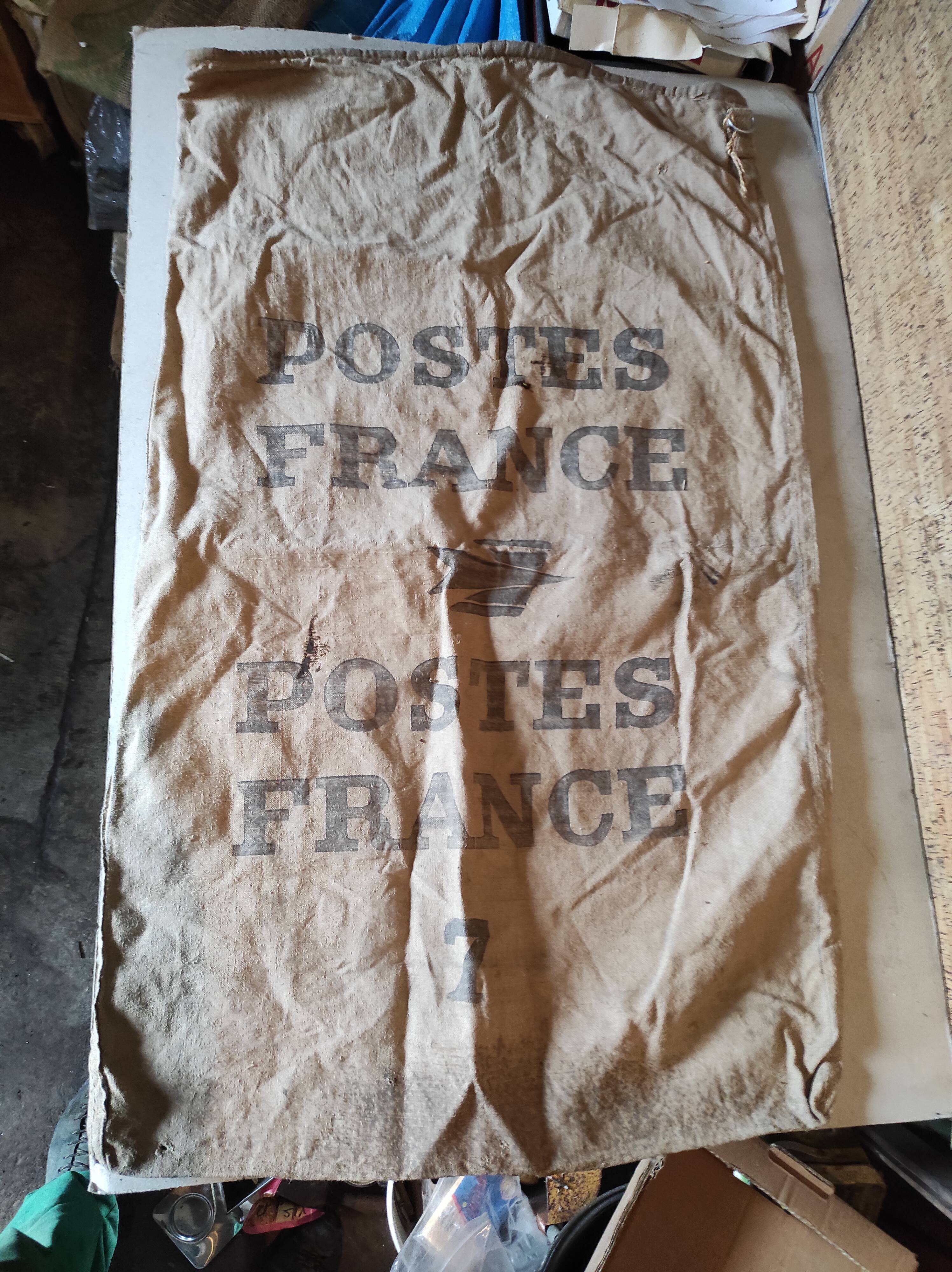 Vintage postal bag trade object of La Poste in mixed-race canvas burlap