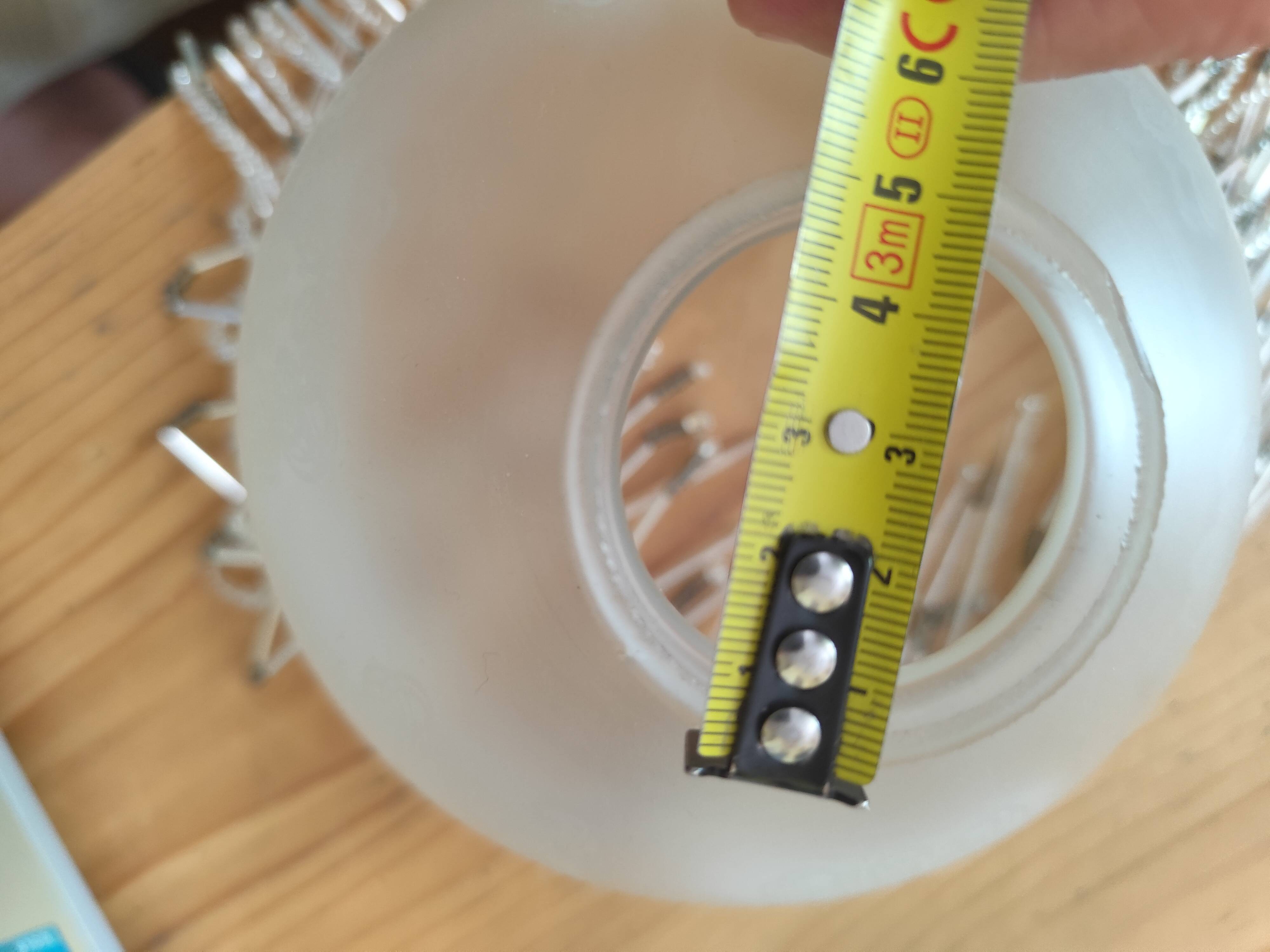Retro brass lamp with a glass shade and bead fringes.