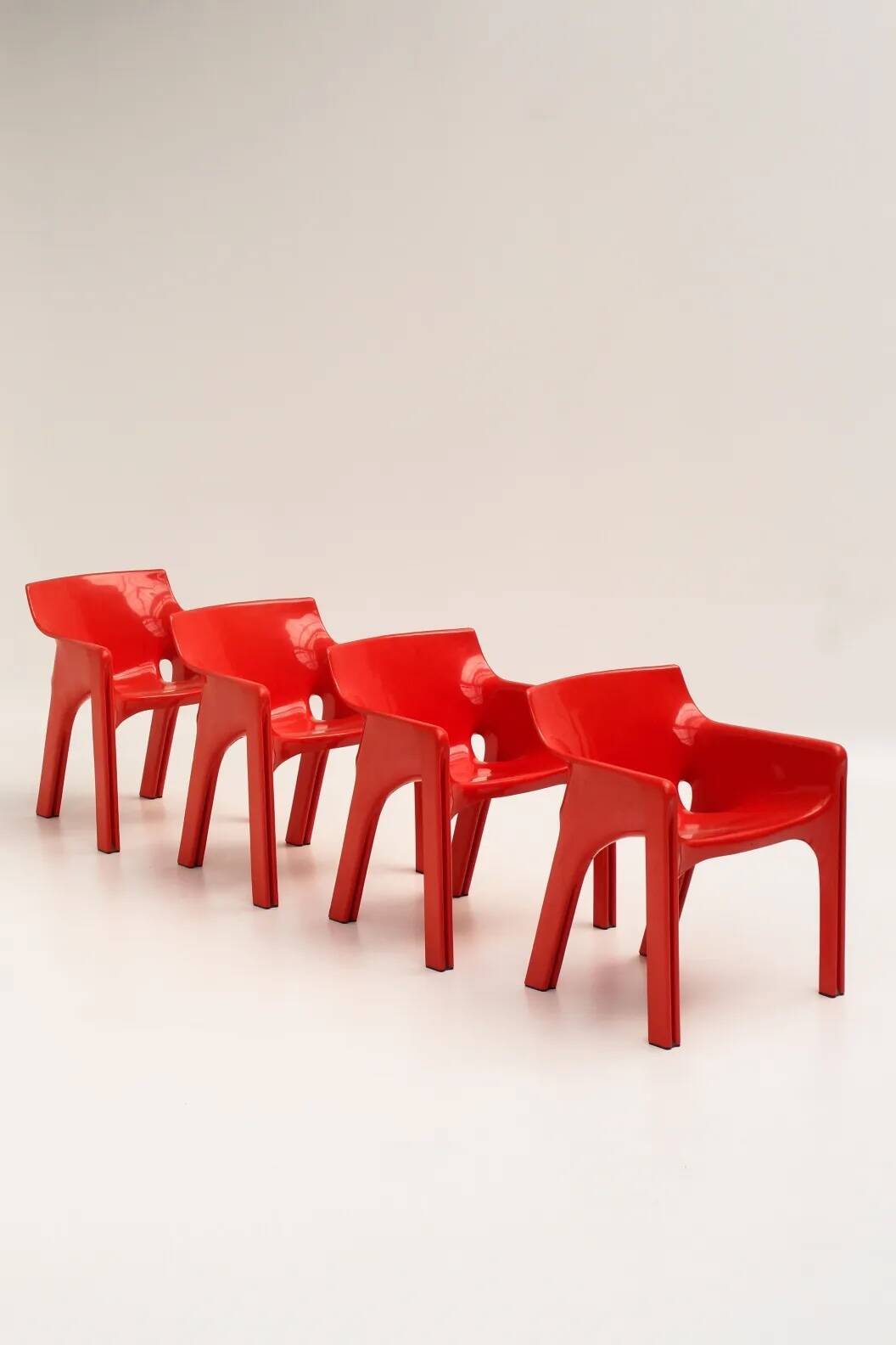 Set of 4 red "Gaudi" armchairs by Vico Magistretti for Artemide