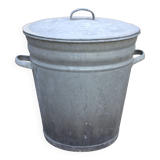 Old galvanized zinc trash can with lid