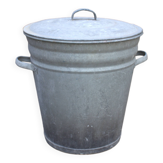 Old galvanized zinc trash can with lid