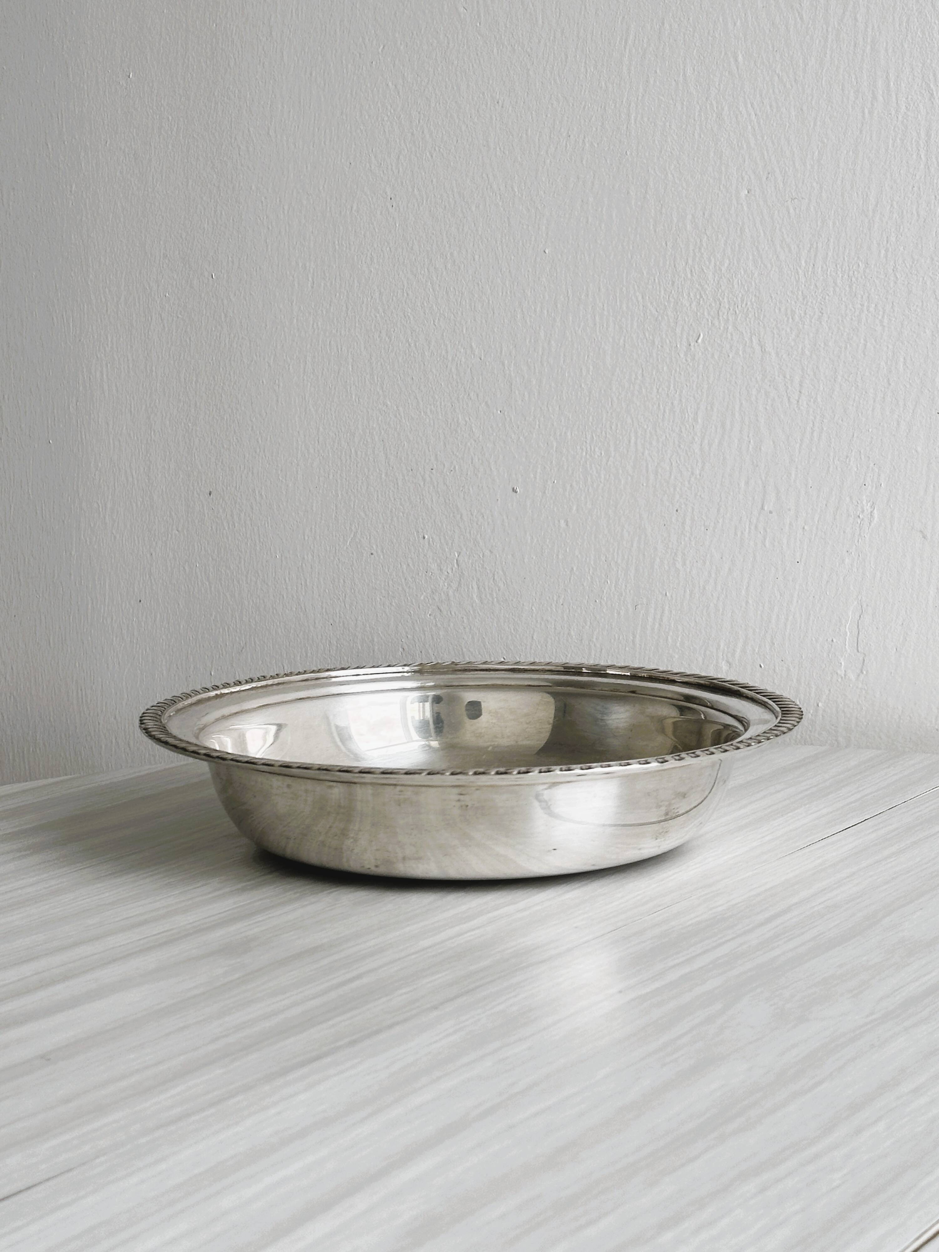 Antique round salad bowl or dish in shiny silver metal