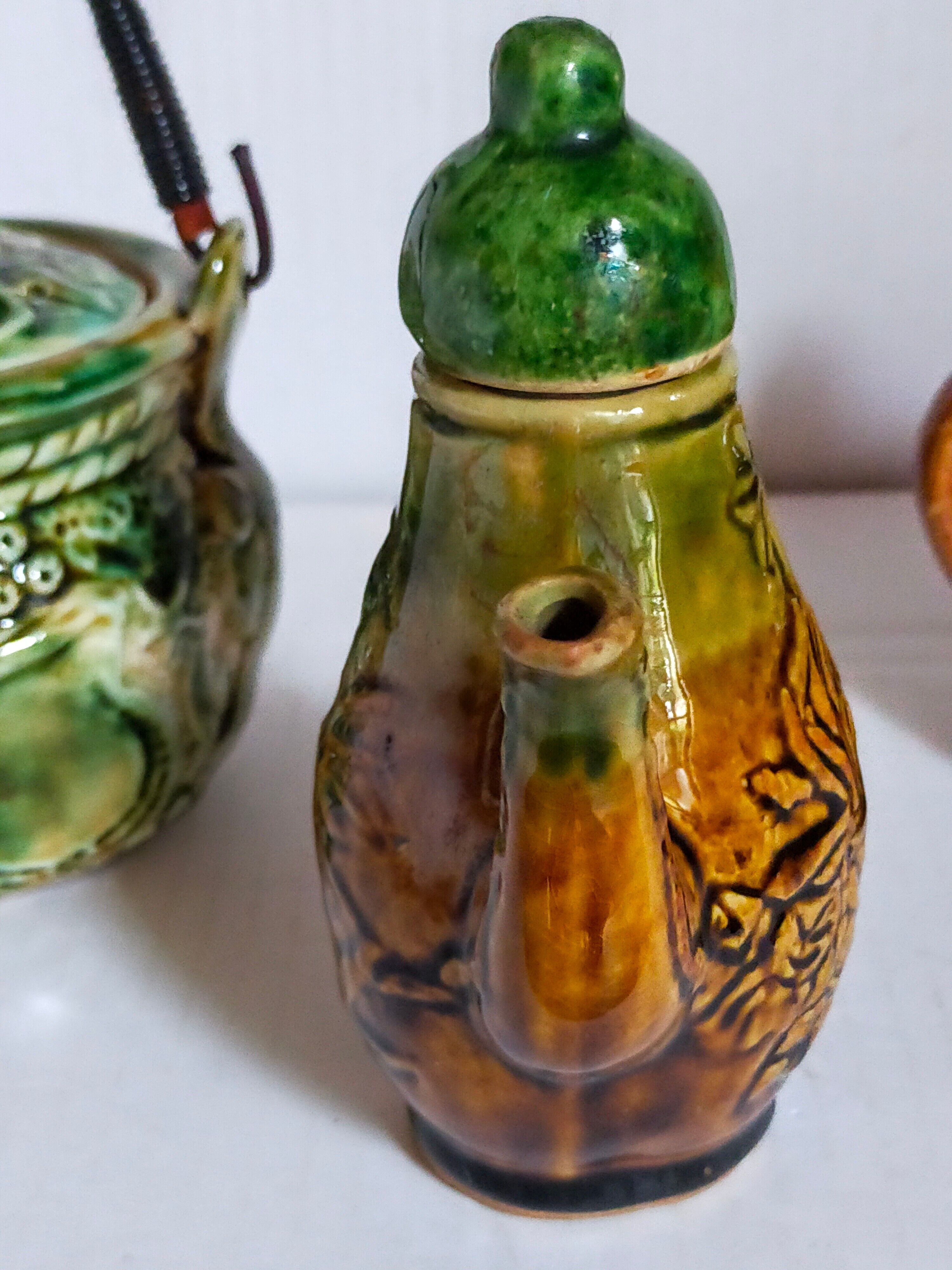 Set of old teapots and honey pot