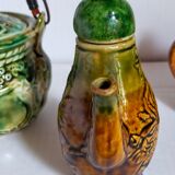 Set of old teapots and honey pot