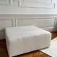Square ottoman and its cushions in buckle fabric