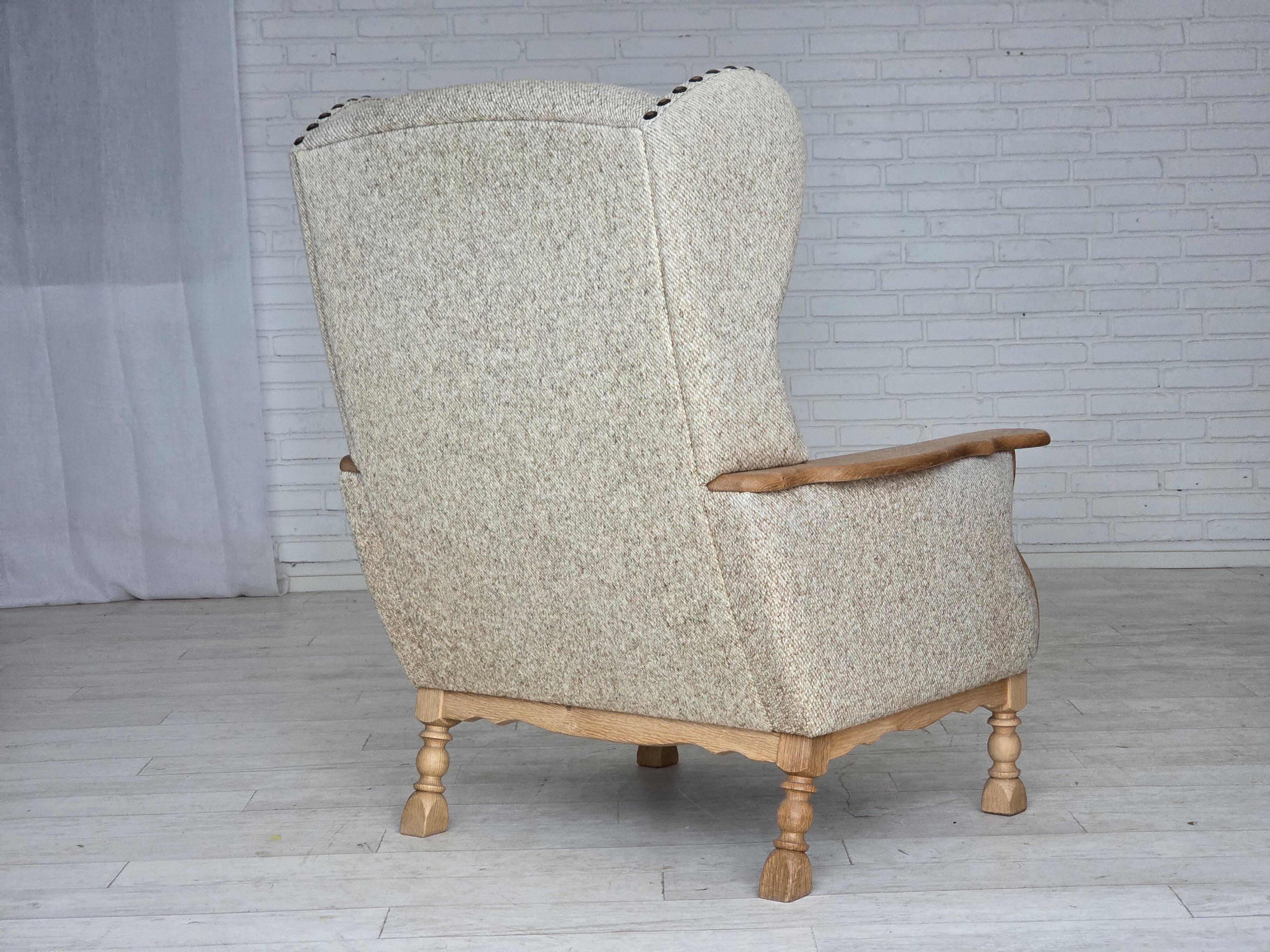 1970s, Danish highback armchair, furniture wool, solid oak wood.