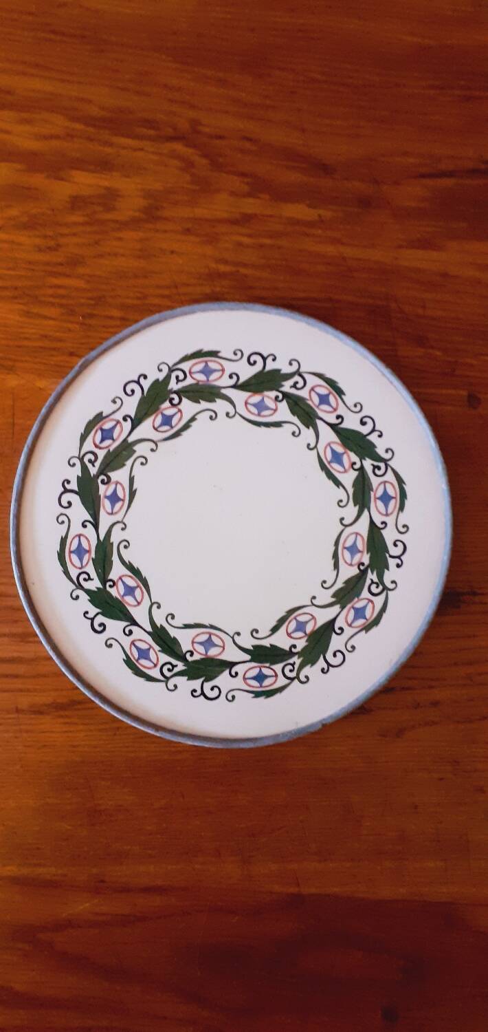 Porcelain and zinc trivet circa 1900