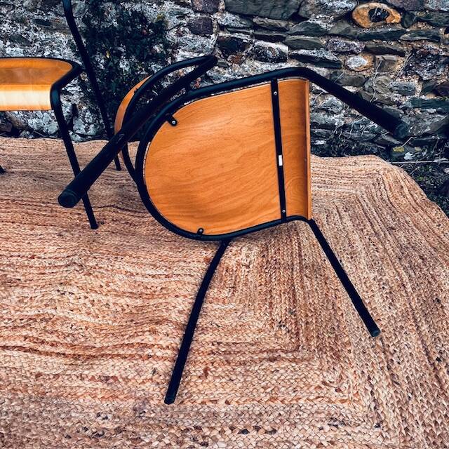 Pair of wooden and black metal chairs