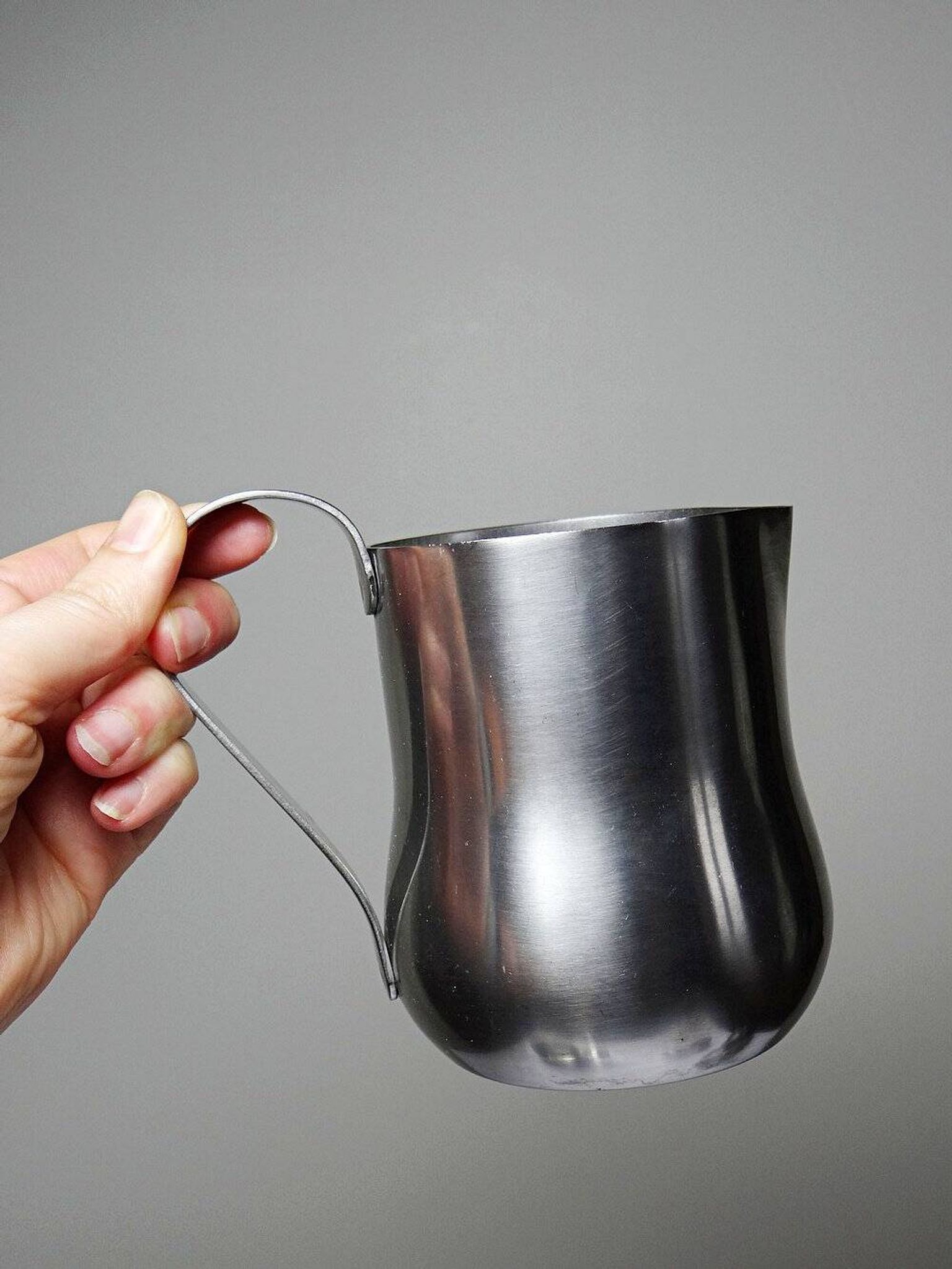 Set of 4 vintage bar measures in brushed stainless steel from the 60s-70s.