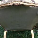 Pair of straight-backed armchairs, known as "queen's armchairs," in carved and gilded wood