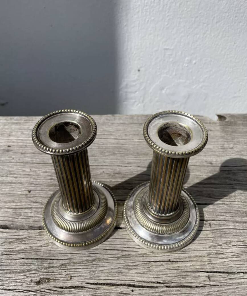 Pair of 19th-century fluted silver-plated metal candlesticks