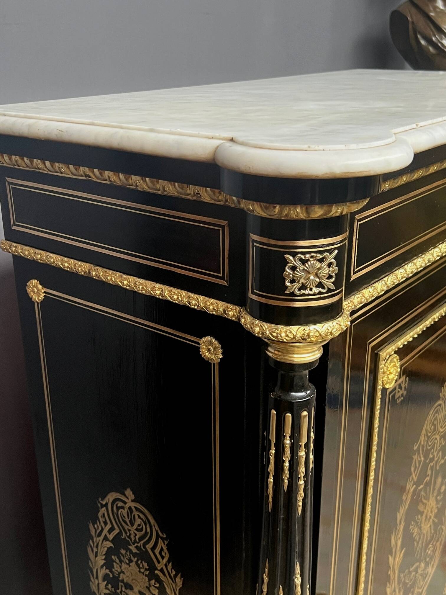 Napoleon III style commode, decorated with brass marquetry and gilded bronze mounts.