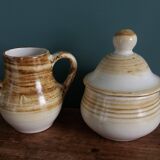 Sugar bowl and milk jug in Longchamp earthenware.