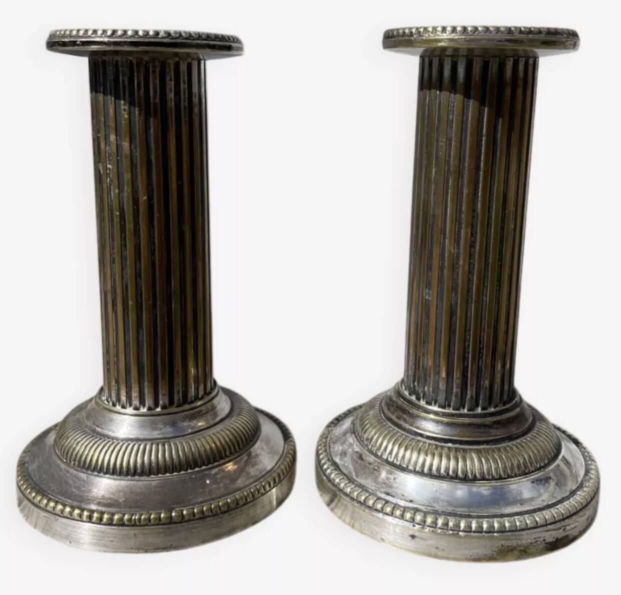 Pair of 19th-century fluted silver-plated metal candlesticks
