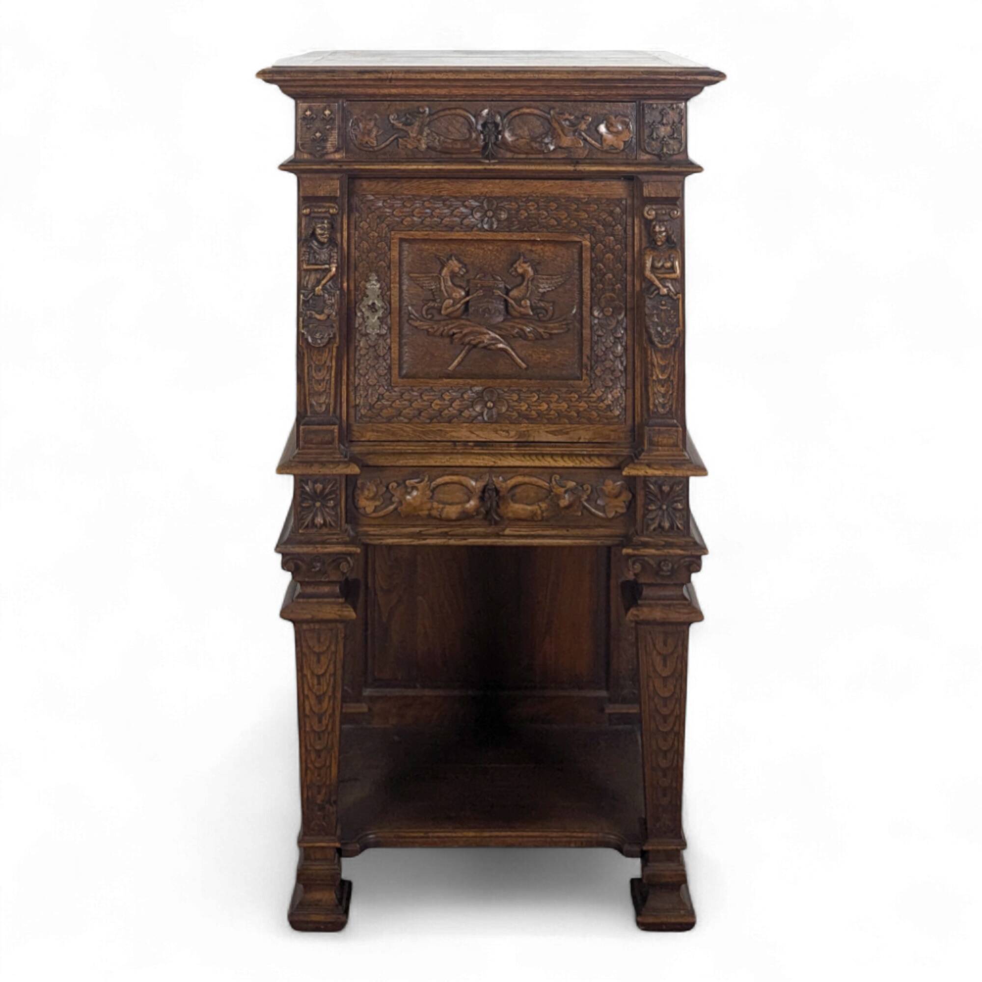 Renaissance-style cabinet in solid oak decorated with chimeras and caryatids