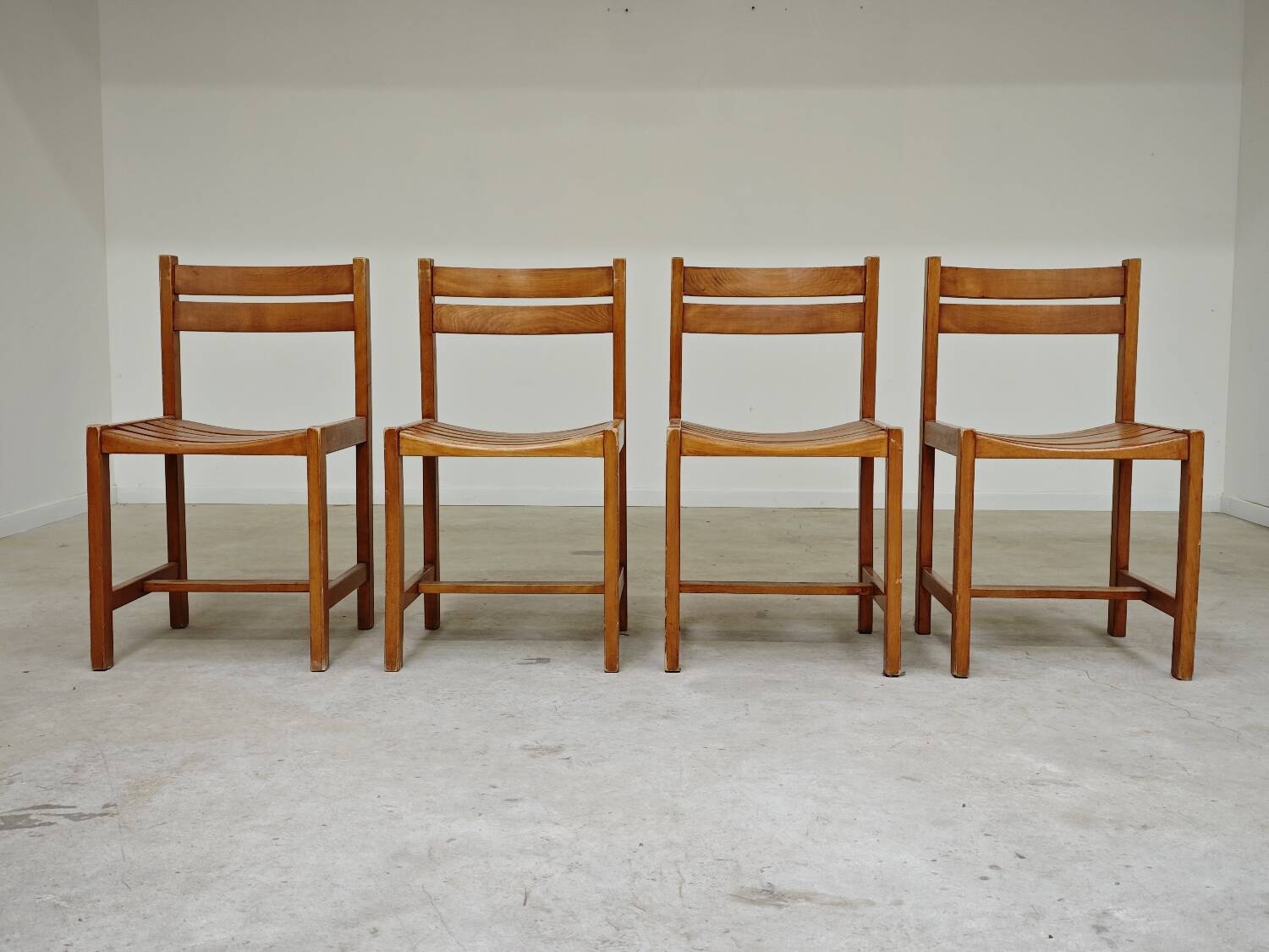 Set of 4 wooden chairs by André Sornay