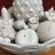 Trompe l'oeil fruit cut in white earthenware by Jean Roger, circa 1960.