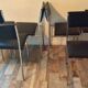Set de 6 chaises vintage 70 piétement chrome assise Skaï noir